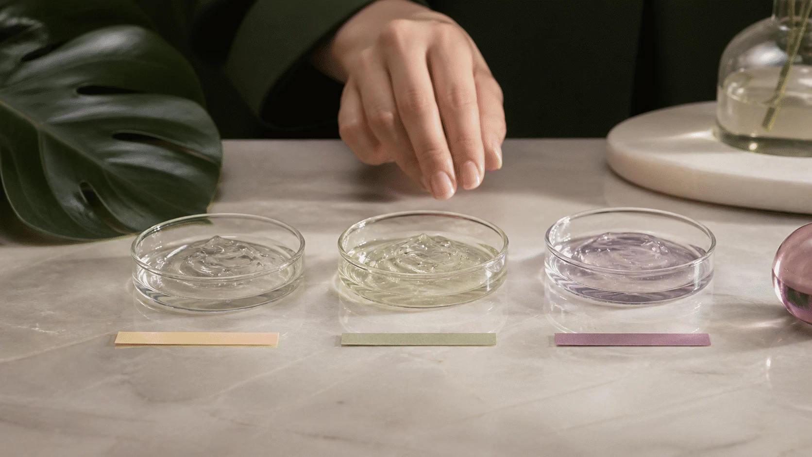 Three clear gel samples paired with unmarked yellow, green, and plum indicator strips.
